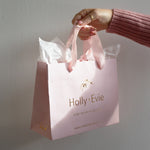 Load image into Gallery viewer, Holly + Evie packaging light pink bag
